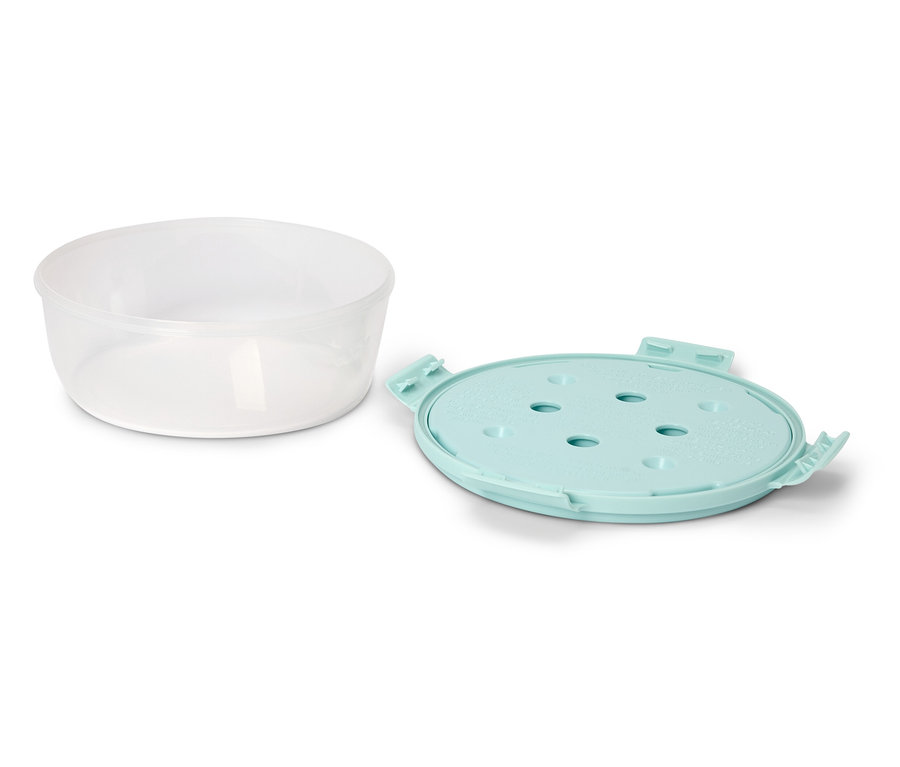 Un bol transparent est posé à côté d'un couvercle bleu clair sur un fond blanc.