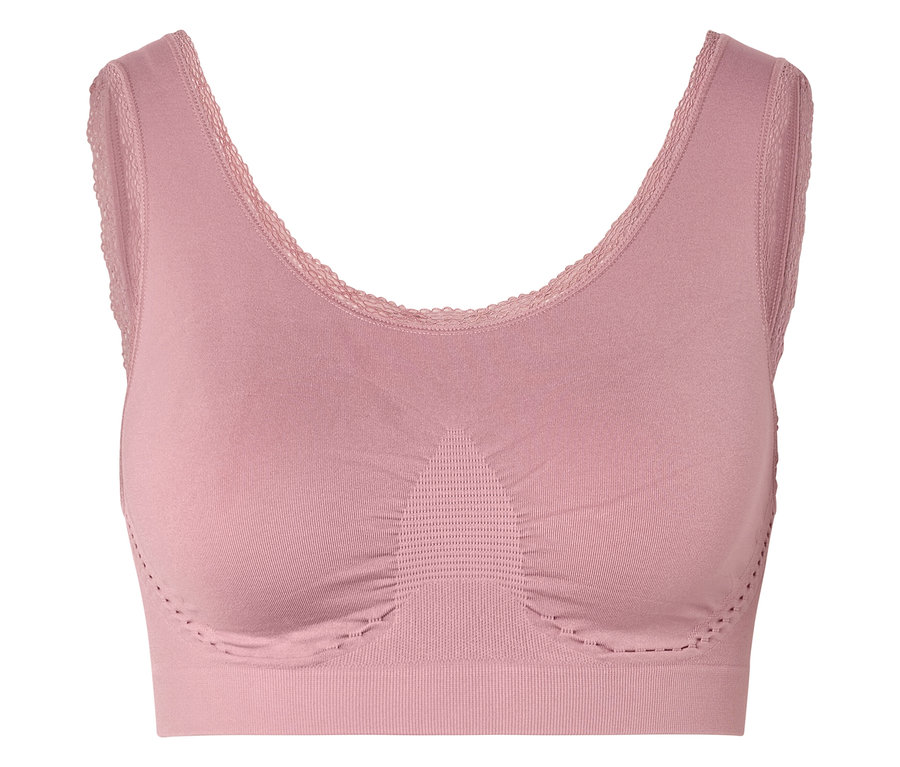 Gros plan d'un soutien-gorge rose avec des finitions en dentelle.