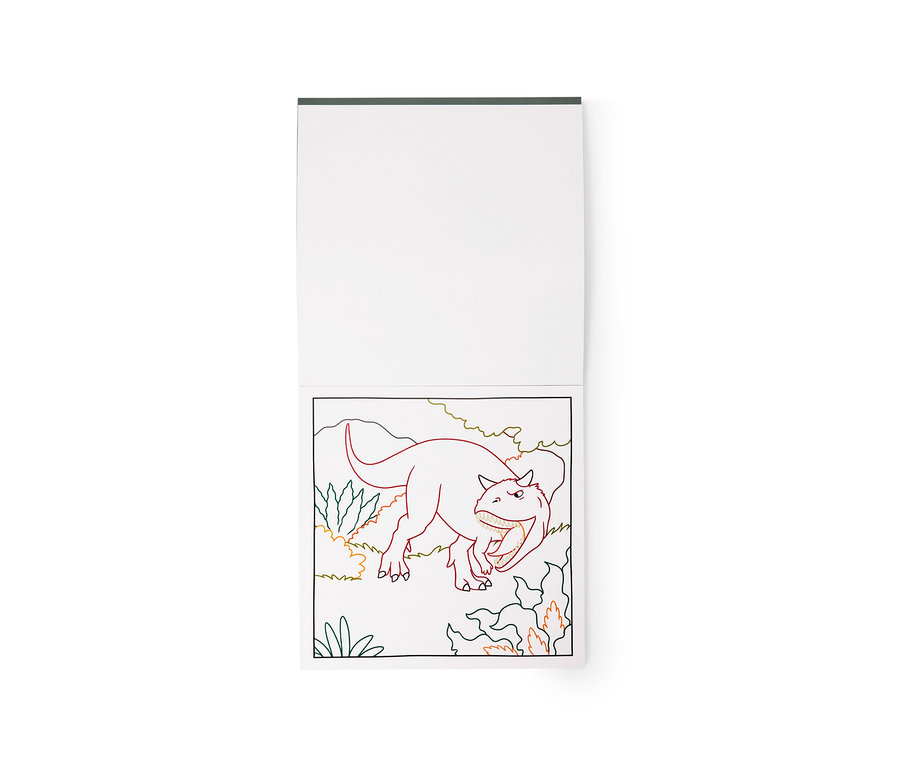 Livre de coloriage ouvert montrant un dinosaure dans une scène de jungle. Le contour du dinosaure est rouge, les plantes sont vertes et oranges. La page supérieure est vierge.