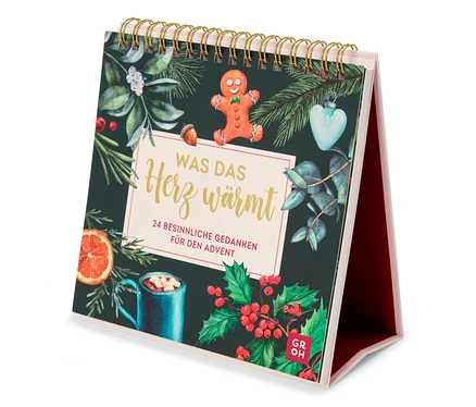Vue d'un calendrier de table sur le thème de Noël, comprenant un bonhomme en pain d'épice et une tasse de boisson chaude.