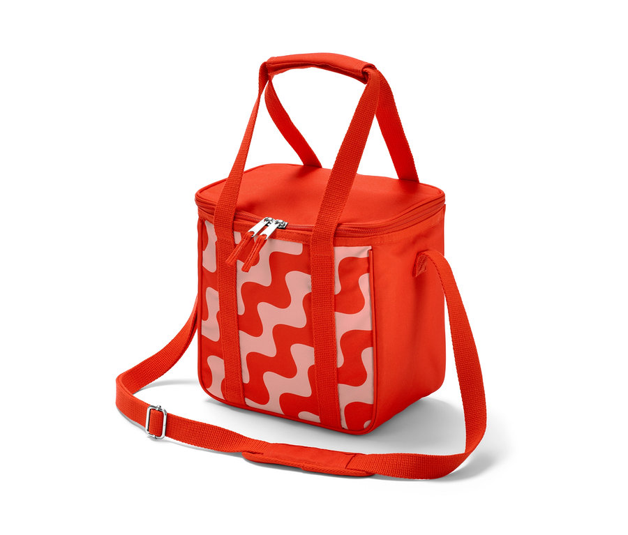 Une petite glacière rouge avec un motif ondulé blanc.