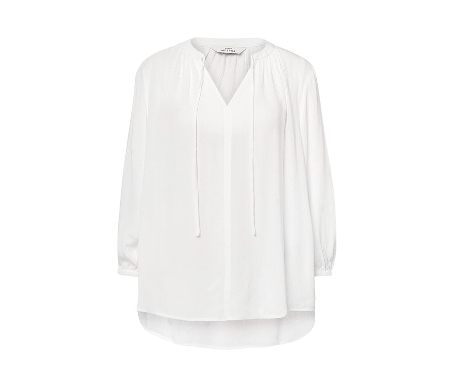 Chemisier-tunique blanc à manches longues et col en V.
