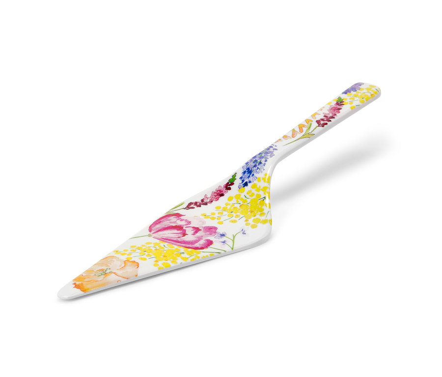 Pelle à tarte blanche avec motif floral.