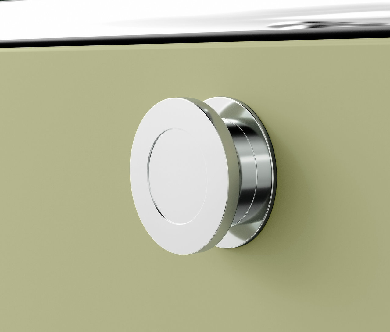 Gros plan d'un bouton de meuble rond chromé sur un meuble vert.