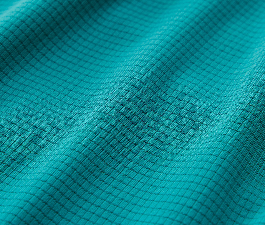 Gros plan d'un short de sport turquoise.