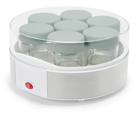 Chauffe-plat pour bébé avec plusieurs pots en verre à l'intérieur.