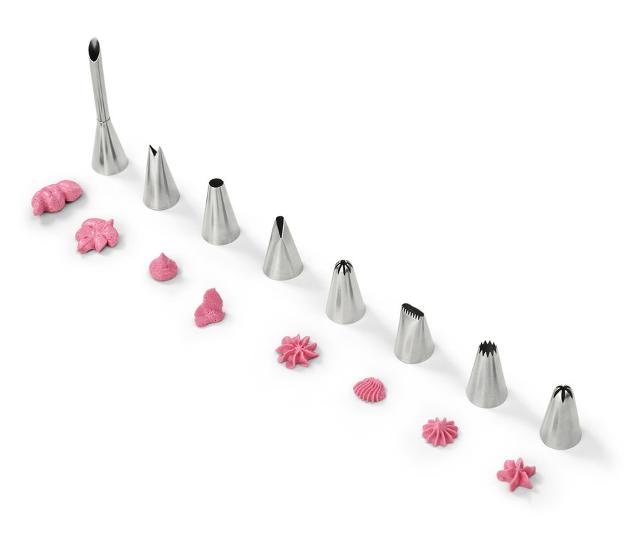 Douilles à décorer avec glaçage rose sur fond blanc.