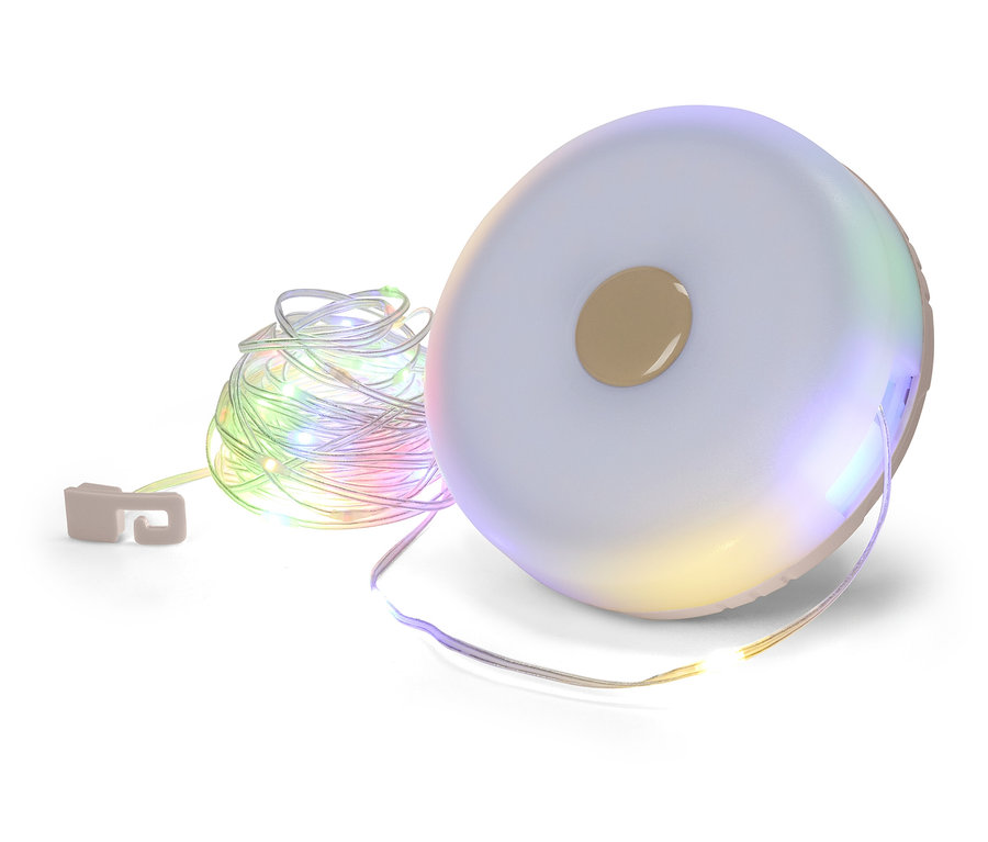 Guirlande lumineuse enroulée sur une bobine ronde blanche avec un bouton marron au centre.