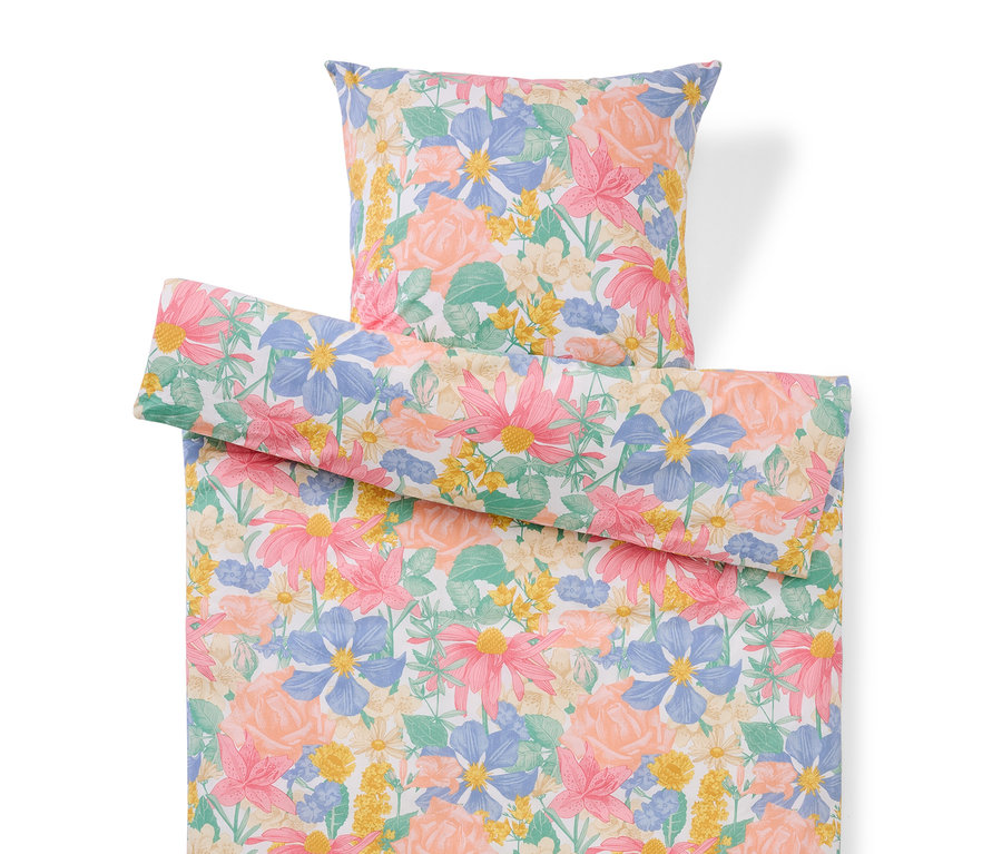 Ensemble de literie à motif floral avec oreiller et housse de couette.