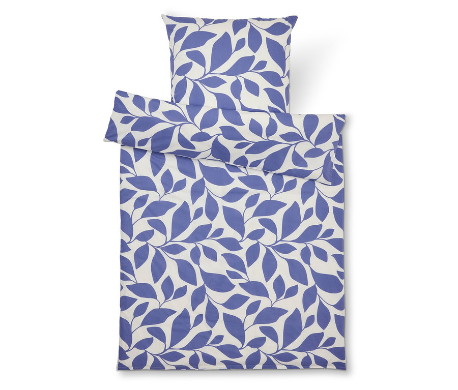 Ensemble de literie avec imprimé de feuilles bleues sur fond blanc, comprenant une taie d'oreiller et une housse de couette.