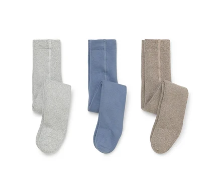 Trois paires de collants pliés posés à plat sur un fond blanc : gris clair, bleu et beige.