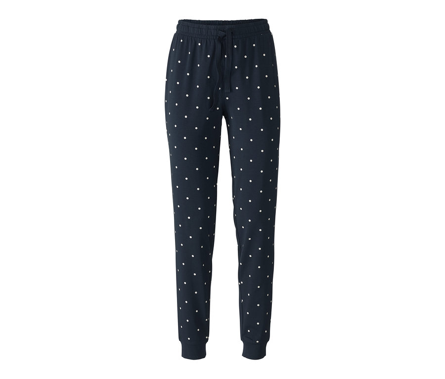 Pantalon de pyjama bleu marine à pois blancs.