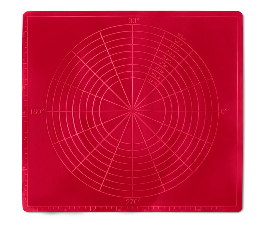 Un tapis de cuisson réutilisable rouge avec des indications d'angle et de centimètres.