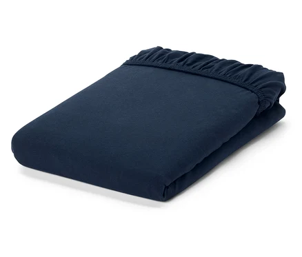Drap-housse marine plié avec coins élastiques.