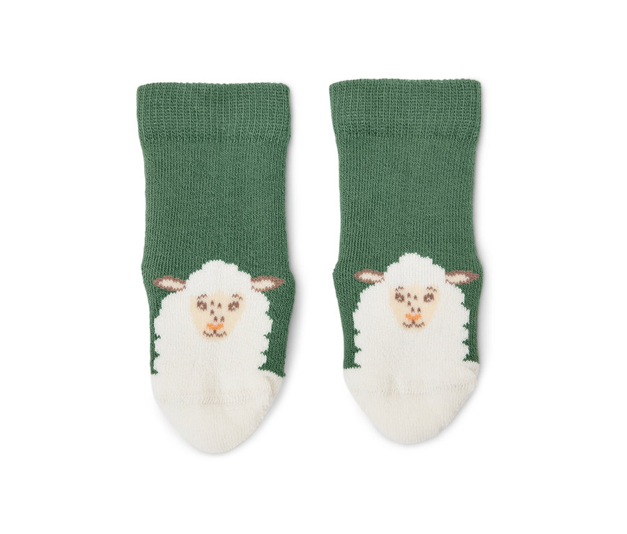 Deux chaussettes en éponge vertes pour bébé avec un motif de mouton.