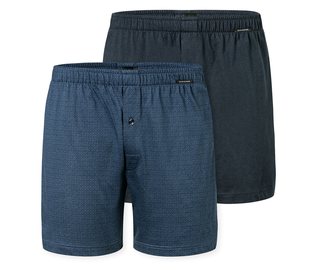Deux boxers SCHIESSER, un bleu à motifs avec bouton, un bleu foncé, sont superposés.