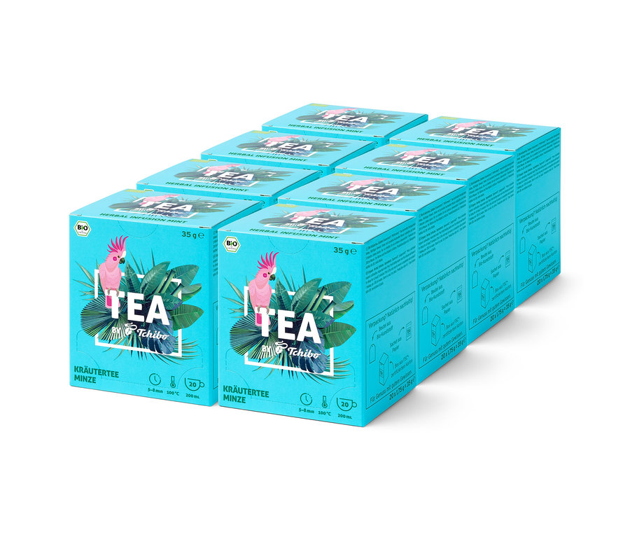 Plusieurs paquets de tisane à la menthe Tchibo disposés en rangée.