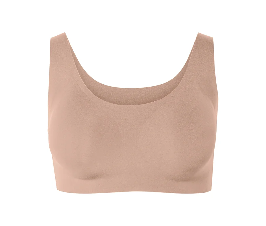 Soutien-gorge de sport couleur pêche.