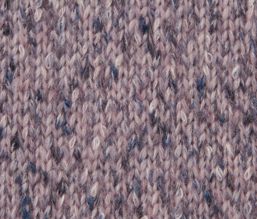 Gros plan d'une veste en maille avec de la laine.