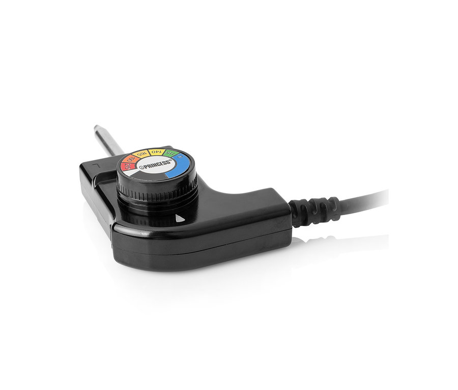 Gros plan sur le thermostat du gril teppanyaki de table.