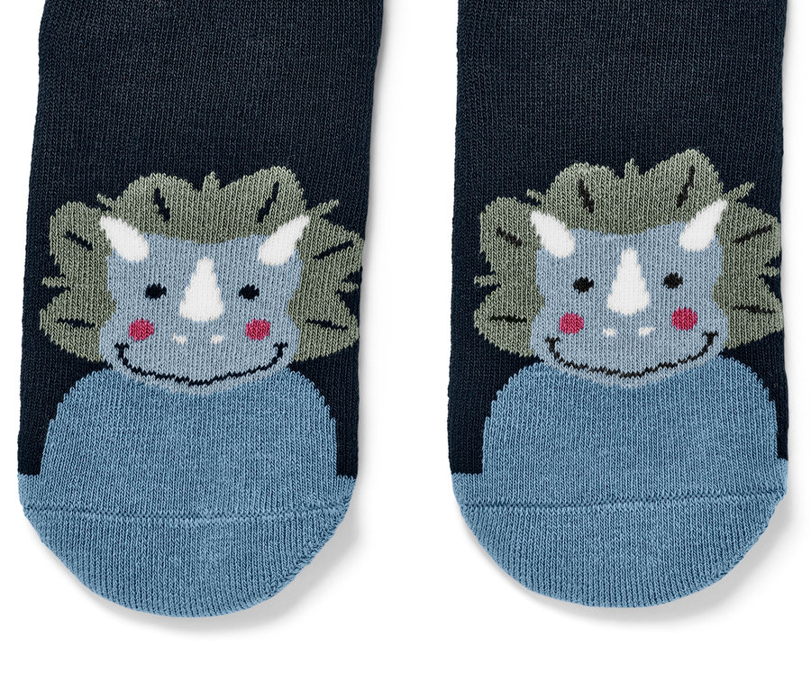 Vue détaillée de 2 paires de chaussettes antidérapantes pour enfant avec motif de dinosaure.