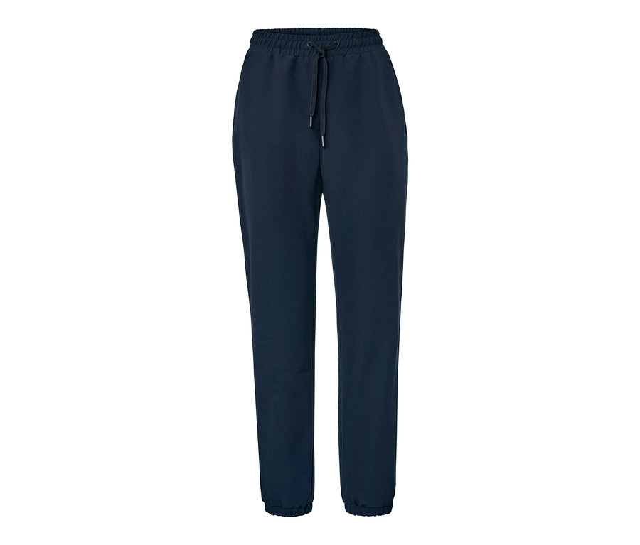 Un pantalon de jogging en softshell bleu marine sur fond blanc.