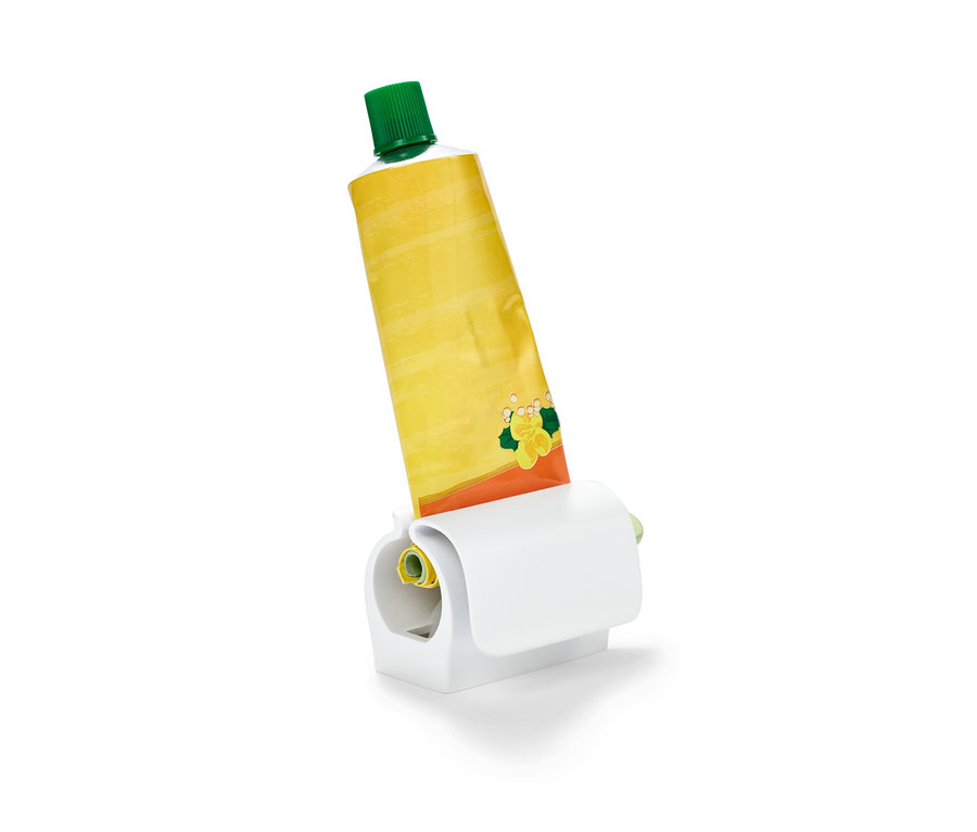 Tube jaune dans presse-tube avec clip pour le réfrigérateur.