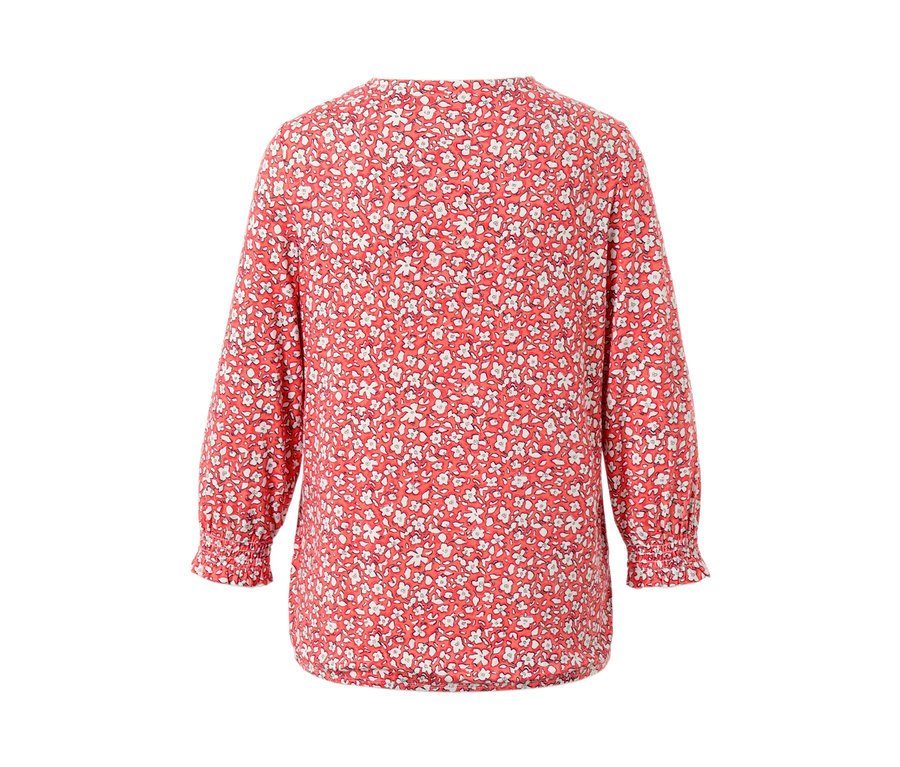 Détail d'une blouse imprimée corail.