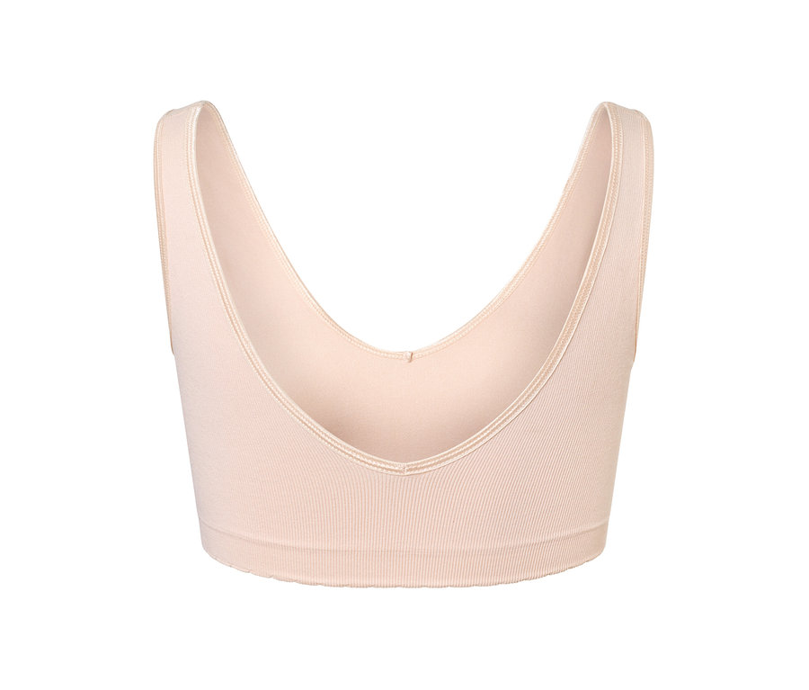 Vue détaillée d'une brassière sans coutures couleur chair.