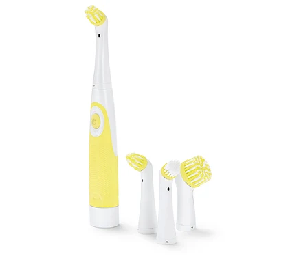Brosse à dents électrique jaune et blanche avec différentes têtes de brosse.