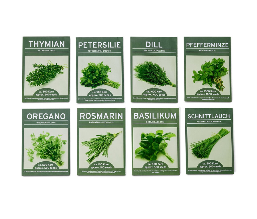 Huit paquets d'herbes classiques 8 herbes aromatiques classiques dans des emballages verts.