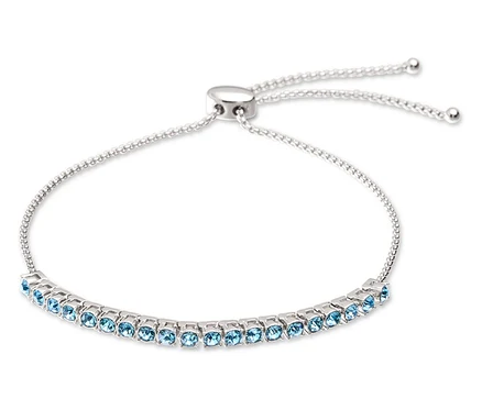 Bracelet argenté avec pierres bleu clair et fermoir réglable.