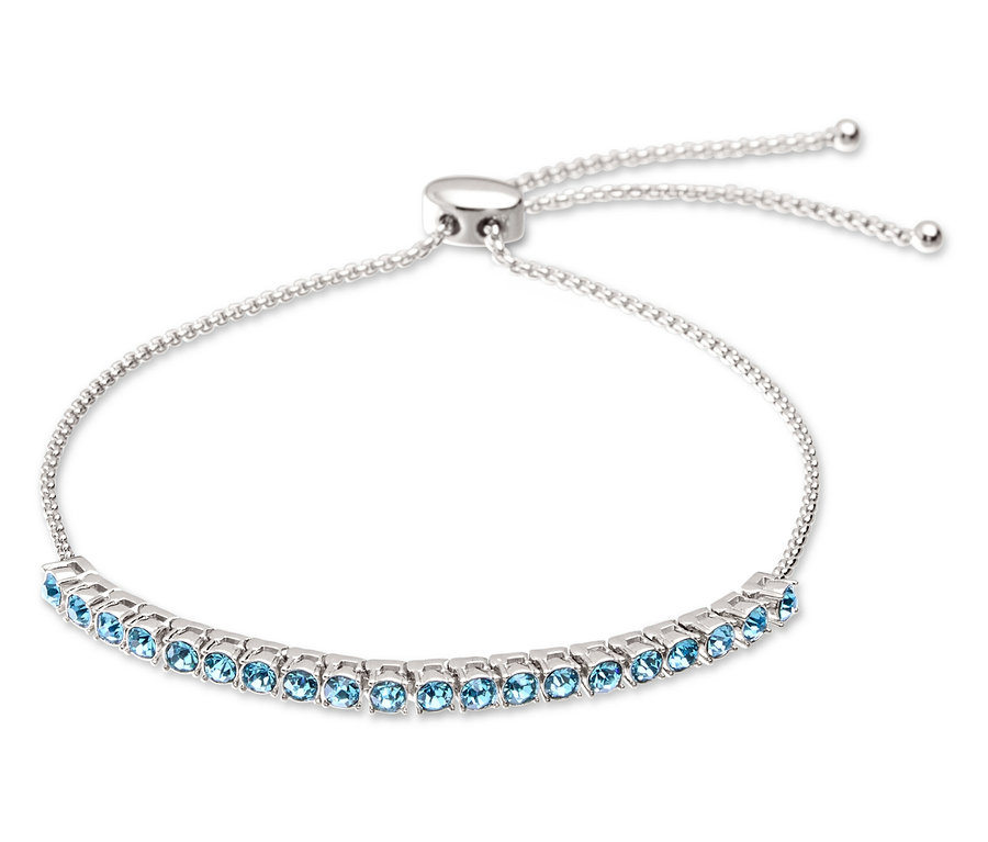 Bracelet argenté avec pierres bleu clair et fermoir réglable.