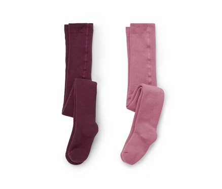 Deux paires de collants posées à plat sur un fond blanc, l'une bordeaux foncé, l'autre rose poudré.