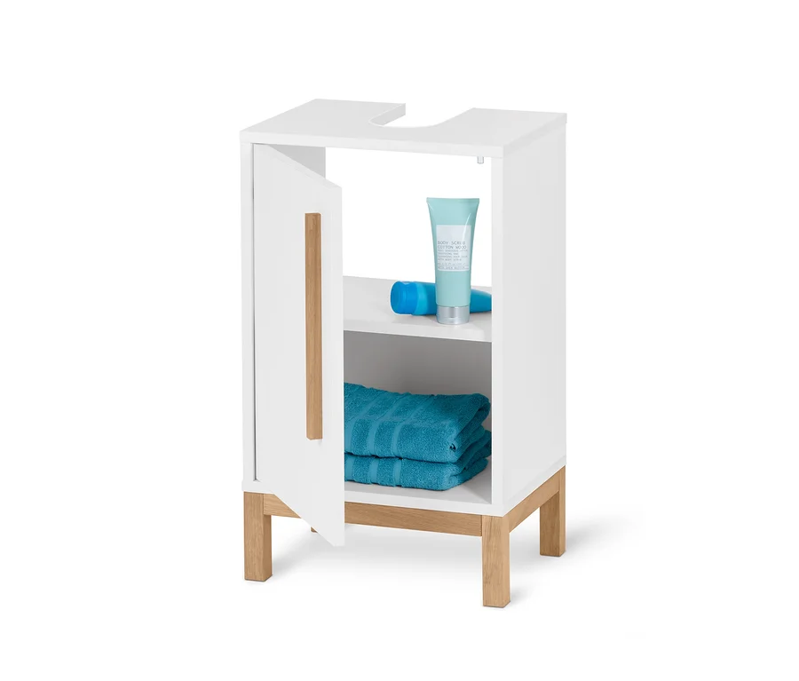 Petite armoire sous lavabo «Eklund» blanche ouverte avec serviettes et cosmétiques.