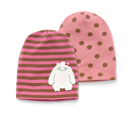 Deux bonnets, un rose avec des points marrons et un rose avec des rayures marrons et un monstre blanc cousu.