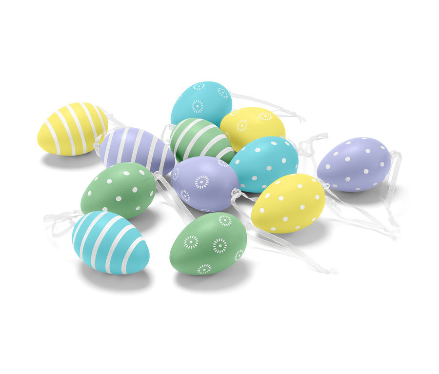 Un ensemble de douze œufs de Pâques décorés de motifs et de couleurs différentes.