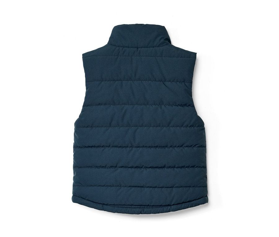 Vue détaillée d'un gilet sans manches matelassé réversible pour enfant bleu marine.