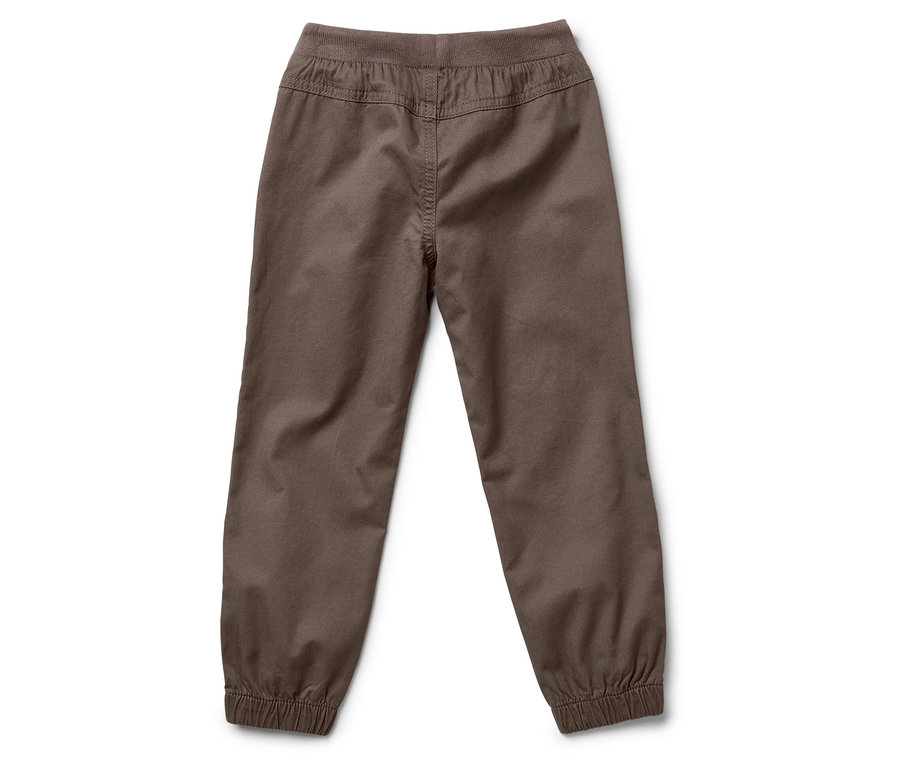 Vue arrière d'un pantalon marron avec cordon de serrage et taille élastique, posé sur un fond blanc.