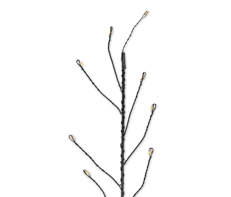 Gros plan sur 3 piquets solaires avec lumières LED au bout des branches.