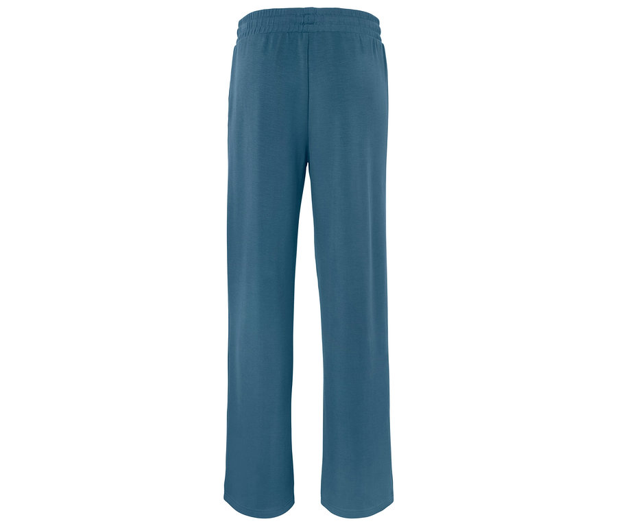 Un pantalon de jogging bleu avec une taille élastique posé sur un fond blanc.