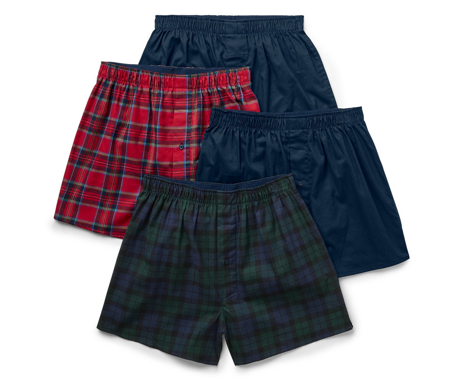 Quatre boxers pour hommes avec taille élastique : deux bleus, un à carreaux rouges et un à carreaux verts.