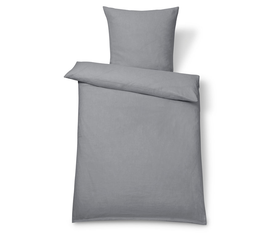 Linge de lit en lin gris, de grande taille, avec un oreiller.