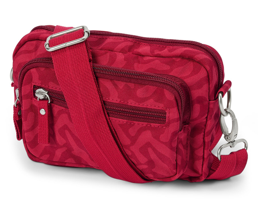 Sac de sécurité à bandoulière rouge avec fermetures éclair et sangle réglable posé sur un fond blanc.