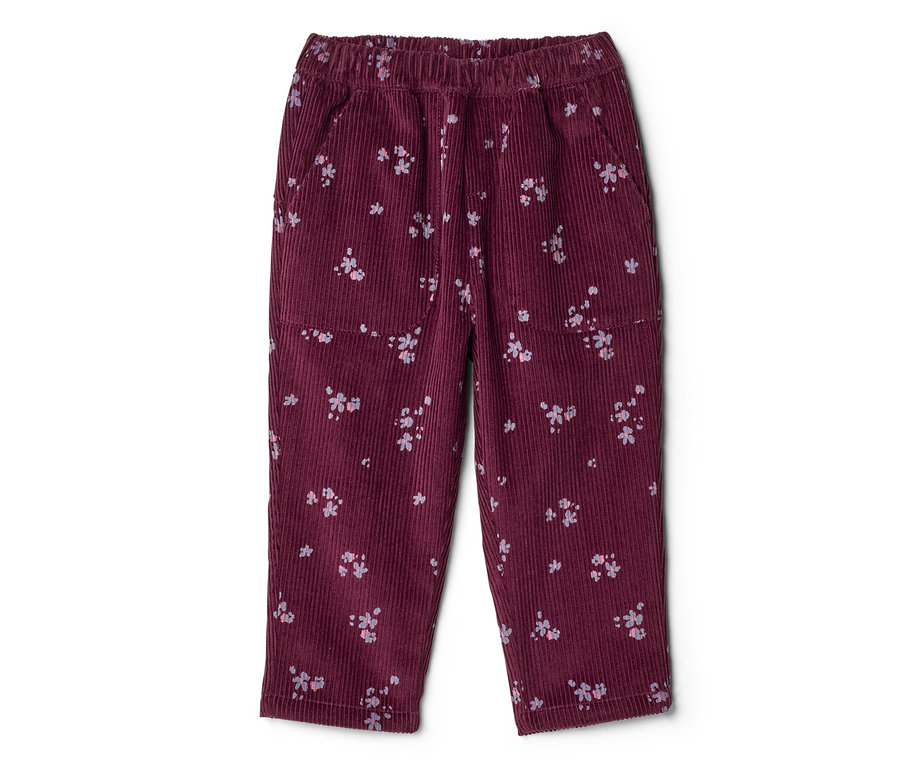 Pantalon en velours côtelé bordeaux avec taille élastique, motif floral rose clair dispersé, poches latérales et poches plaquées sur les cuisses.