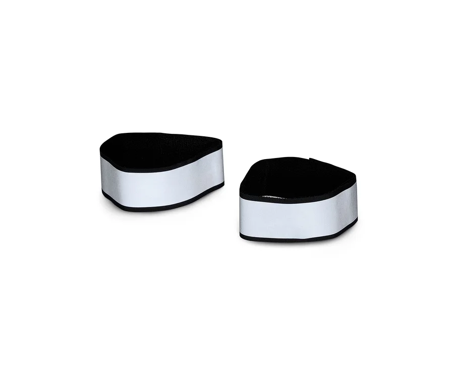 Deux bandes réfléchissantes, blanc argenté à l'extérieur avec une bordure noire et un intérieur noir, sont placées côte à côte sur un fond blanc.