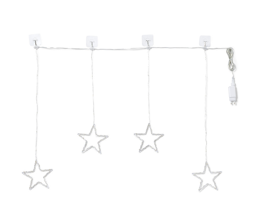 Quatre étoiles lumineuses à LED suspendues à un rideau lumineux à LED.