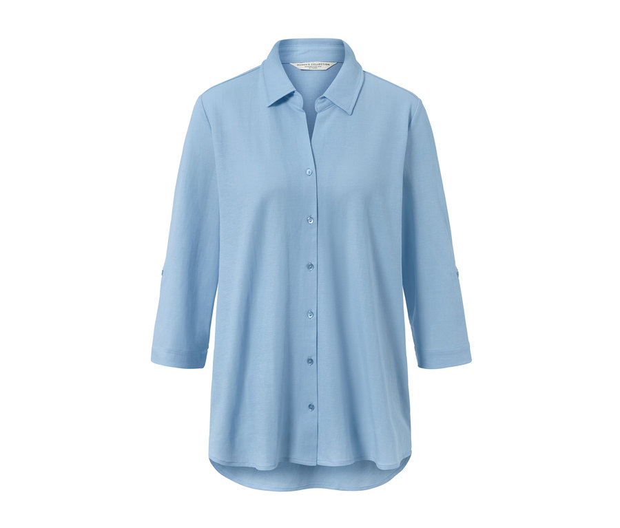 Chemisier en jersey piqué bleu clair à manches trois quarts.