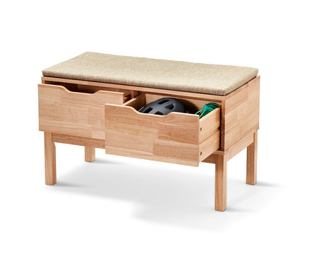 Banc avec tiroirs dont un est ouvert, présentant un casque et des gants.