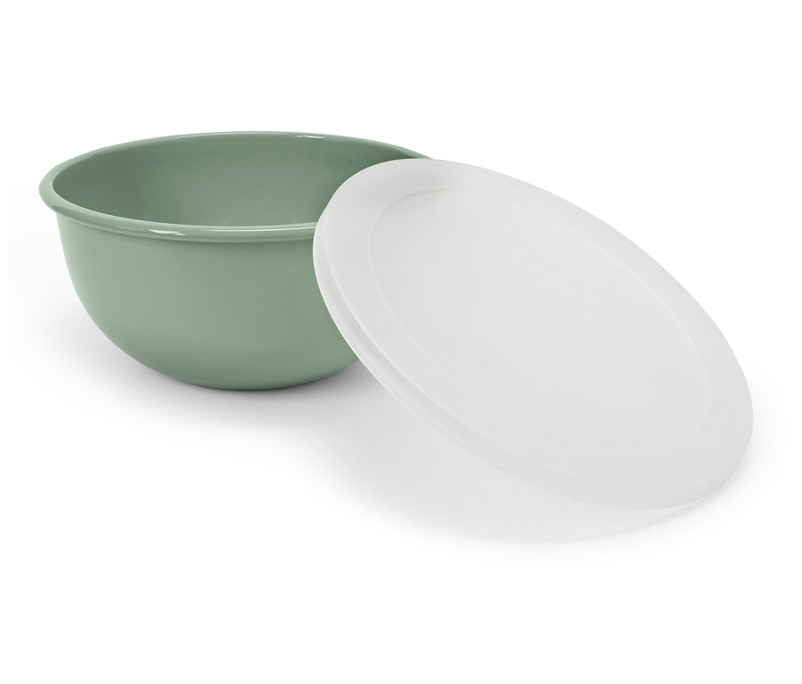 Un bol vert avec un couvercle blanc posé à côté.